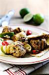 Grilled turkey kebabs with limes and unleavened bread