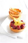Raspberry tartlets with star fruit