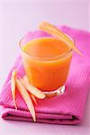 A glass of carrot and apple juice