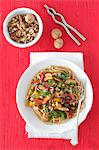 Wholemeal spaghetti with turkey, peppers, parsley and walnuts