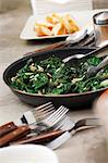 Cooked spinach with raisins and pine nuts