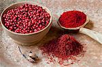 Red peppercorns, saffron threads and paprika