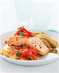 Poached salmon on potato rösti with tomatoes and fennel