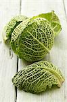 Head of savoy cabbage and leaves