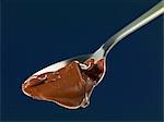 Melted chocolate on a spoon