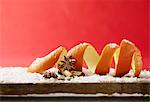 Still life with orange peel, cinnamon, star anise and powdered sugar