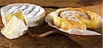 Sliced camembert on a cutting board