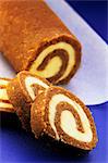 Coffee Swiss roll, partly sliced