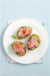 Crostini with broad beans, smoked ham and mint