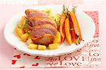 Duck breast with pineapple, oranges and baby carrots