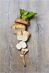 A Sliced Raw Sugar Beet on a Wooden Surface