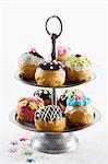 Assorted doughnuts for Hanukkah on a tiered cake stand