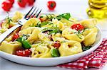 Tortelloni with cherry tomatoes and rocket