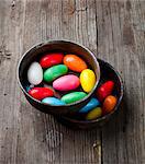 Colourful sugar eggs in ceramic pots