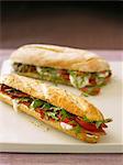 Baguette sandwiches filled with tomato, mozzarella and rocket