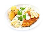 White asparagus and a schnitzel with Hollandaise sauce and potatoes