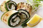 Grilled zucchini rolled up with ricotta - herb paste