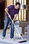 Man cleaning floor with a mop