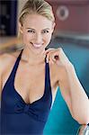 Portrait of a beautiful woman smiling at the poolside