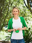 Smiling beautiful woman holding a pouch bag