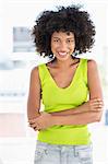 Woman standing with her arms crossed and smiling