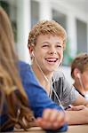 Students listening to music in a classroom