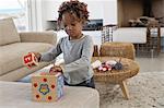 Girl playing with toys at home