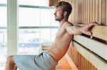 Man relaxing in a sauna