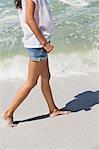 Woman walking on the beach