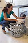 Woman doing laundry at home