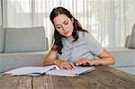 Woman doing paperwork at home