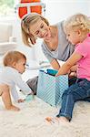 Smiling woman playing with her children