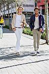 Portrait of a couple walking on a street