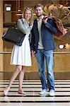 Smiling couple standing on an airport