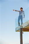 Man standing on the terrace and pointing