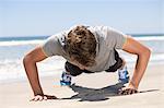 Man exercising on the beach