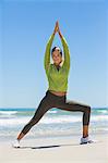 Woman exercising on the beach