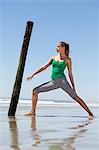 Woman exercising on the beach