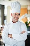 Portrait of a chef smiling with arms crossed