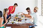 Friends eating lunch at dining table