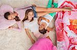 Girls sleeping on a carpet at a slumber party