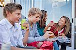 Friends enjoying fast food together