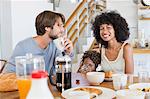 Parents with their daughter at a dining table