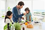 Man preparing food for his children