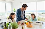 Man preparing food for his children