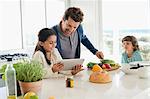 Man preparing food for his children