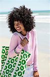 Close-up of a woman smiling on the beach