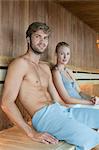 Portrait of a couple relaxing in a sauna