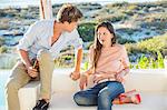 Couple enjoying beer outdoors on a vacation