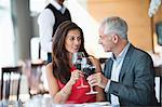 Couple enjoying red wine in a restaurant